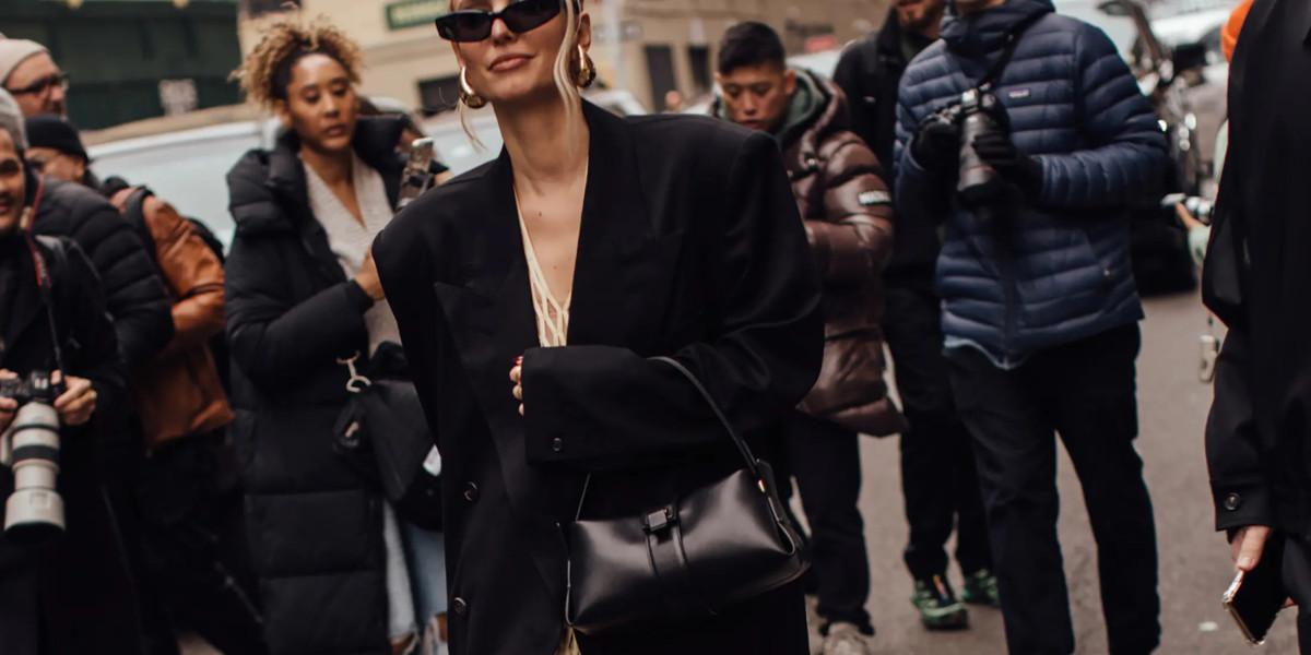 With its half zipped up Prada Handbags Sale neckline and sweeping train